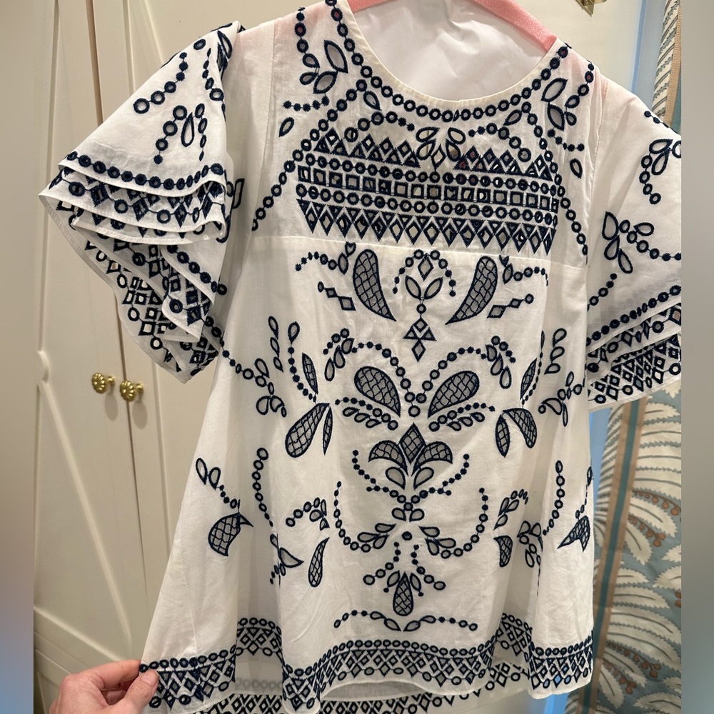 Parker top. White with navy eyelet embroidery.